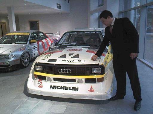 Man In Suit Pictured With Audi Rally Car